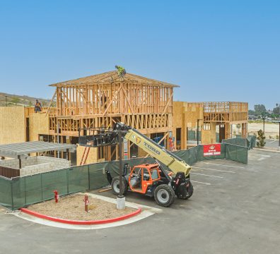Visible wooden beams and studs forming the structure of a house in progress.