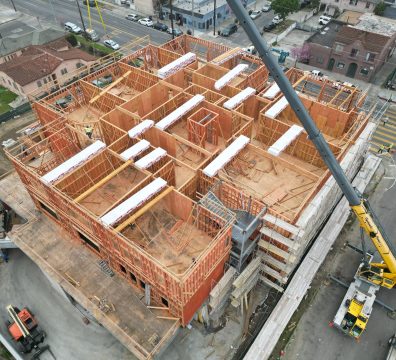 House construction showing the wooden frame with exposed beams and studs.
